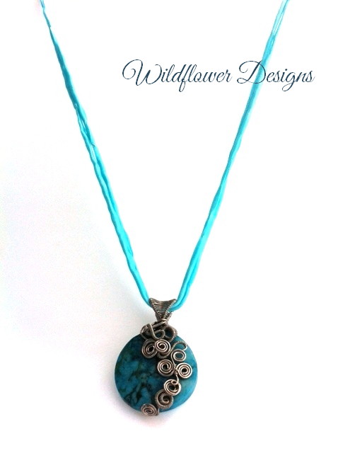 turquoise jasper focal pendant with silver wire swirls and silk cord
