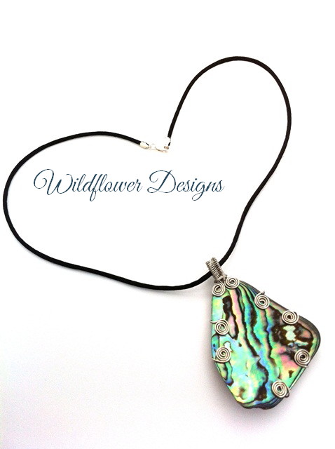 paua feature with silver wire swirls on satin cord