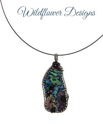 paua pendant framed with black and silver wire wrap