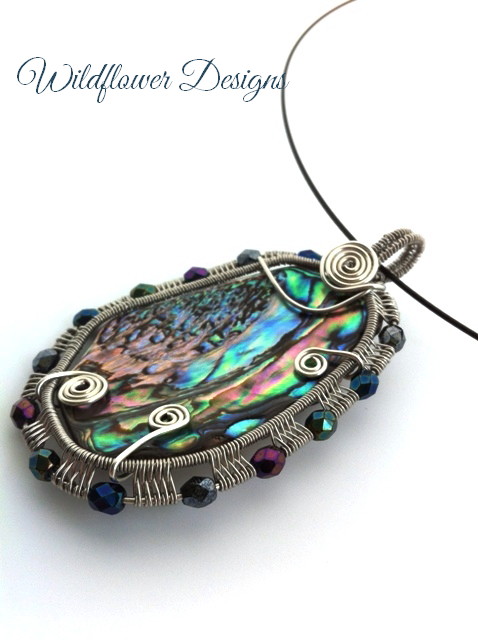 wire woven framed paua pendant with fire polished beads