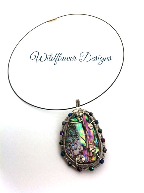 wire woven framed paua pendant with fire polished beads
