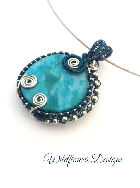 turquoise jasper coin with deep teal and silver wire wrap